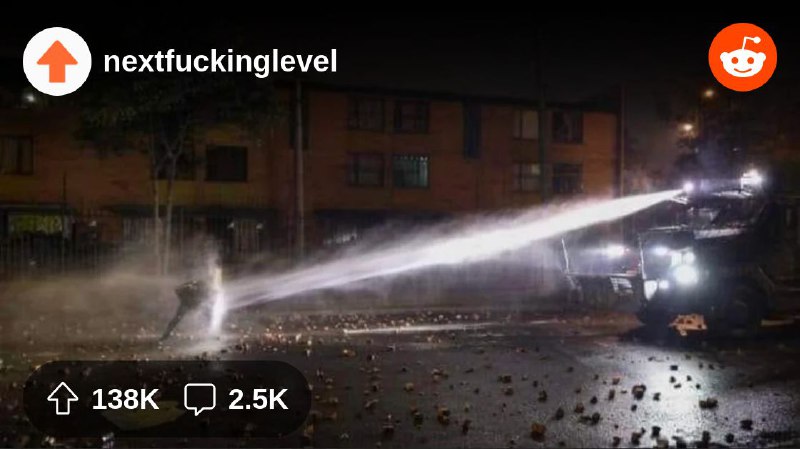 From the nextfuckinglevel community on Reddit: A guy holding the line with a home-made shield against an armored water cannon truck…